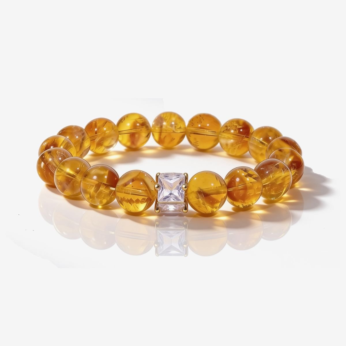 Golden Signature Citrine Bracelet with green inlay centerpiece styled in natural light