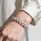 Mystic Moonstone Bracelet styled with a cream sleeve for a soft and elegant everyday look