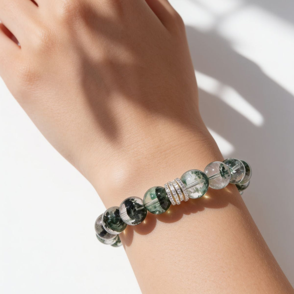 Natural Green Phantom Quartz crystal bracelet worn on the wrist with layered forest-like inclusions