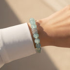 12mm aquamarine beaded bracelet worn on wrist with polished everyday styling