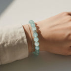 Ocean Calm Aquamarine Bracelet worn on wrist with soft neutral sweater