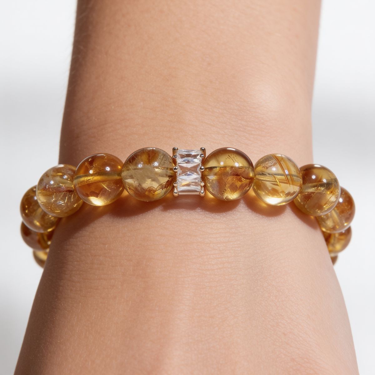 Radiant Citrine Beaded Bracelet worn on the wrist, showing natural Brazilian citrine 11mm beads and the signature centerpiece accent.