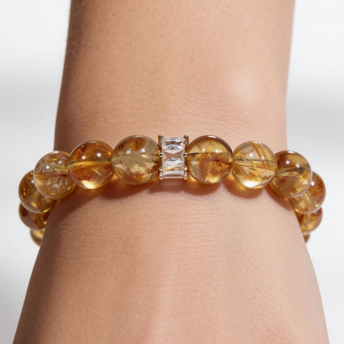 Radiant Citrine Beaded Bracelet worn on the wrist, showing natural Brazilian citrine 11mm beads and the signature centerpiece accent.