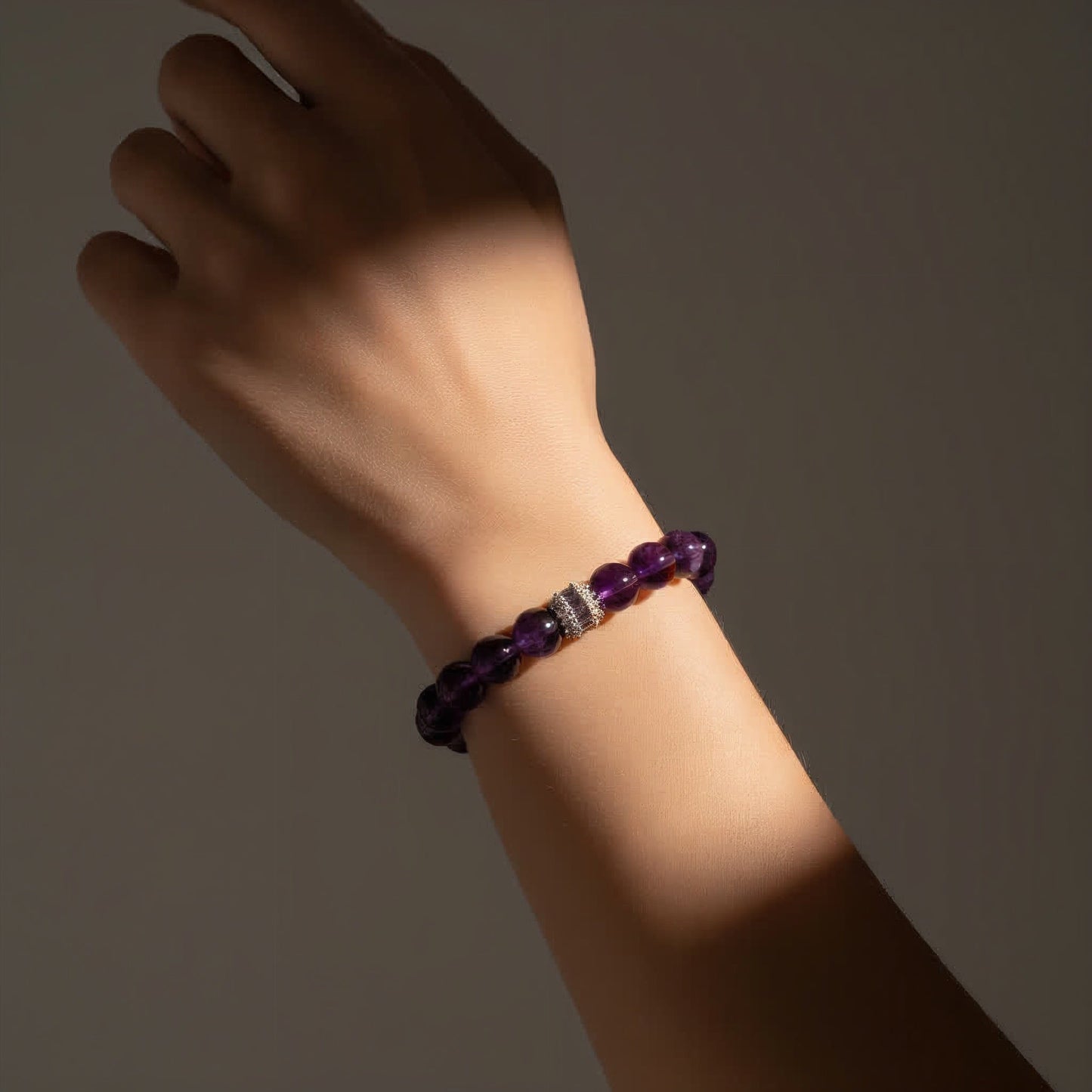 women's amethyst healing bracelet shown on wrist, spiritual jewelry for anxiety relief and peace
