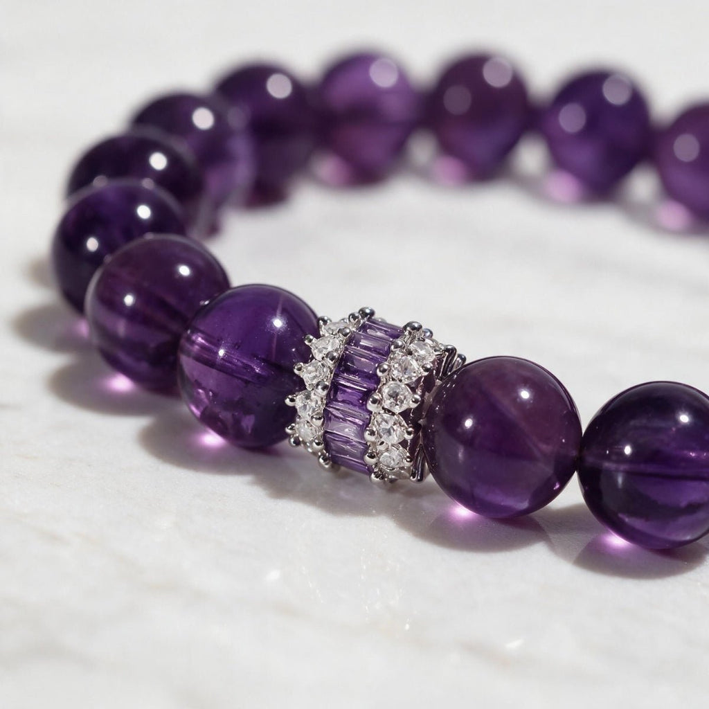 Macro view of hand-polished amethyst beads and the refined inlaid centerpiece.