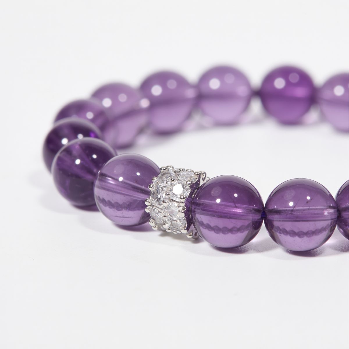 Close-up of Serenity Bloom Amethyst Bracelet showing Lavender Amethyst bead detail and sterling silver crystal centerpiece
