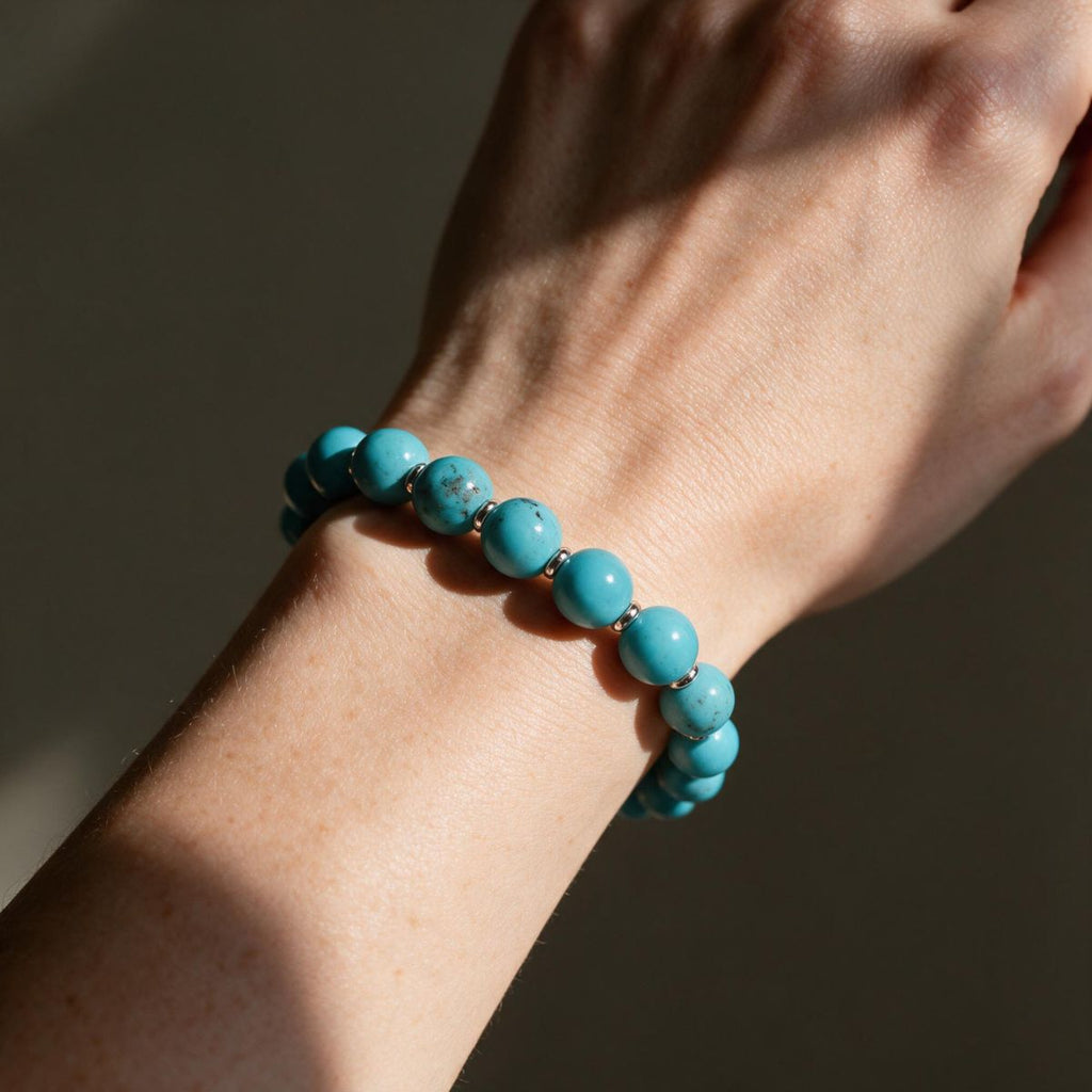 Skybound turquoise beaded bracelet worn on a woman's wrist