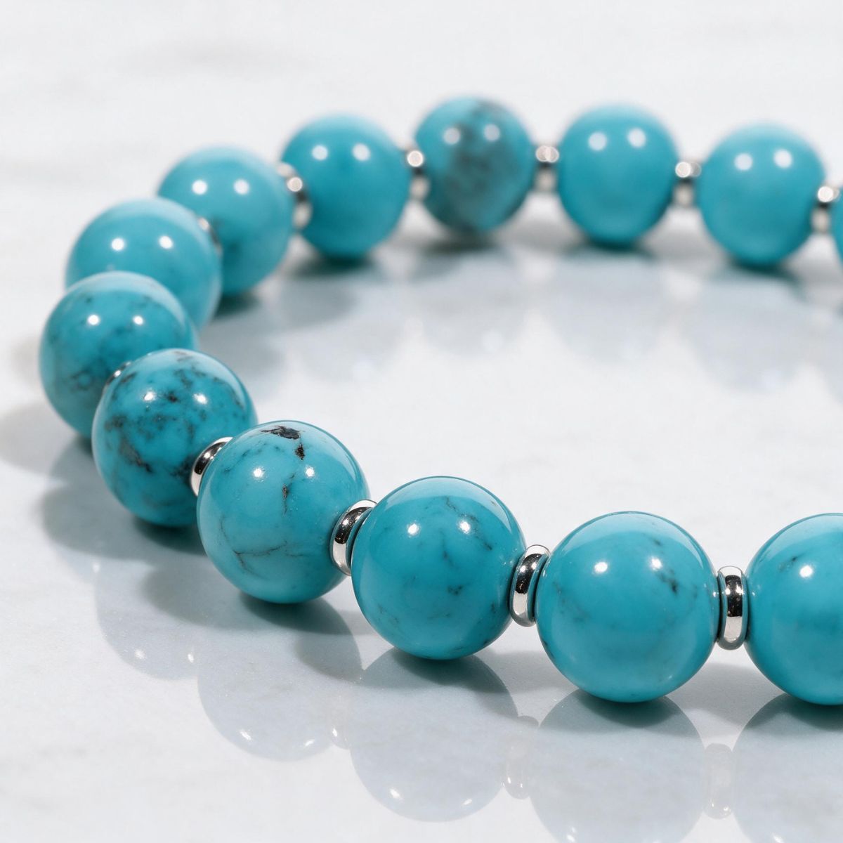 Close-up of Skybound natural turquoise beads with unique matrix patterns and polished metal spacers