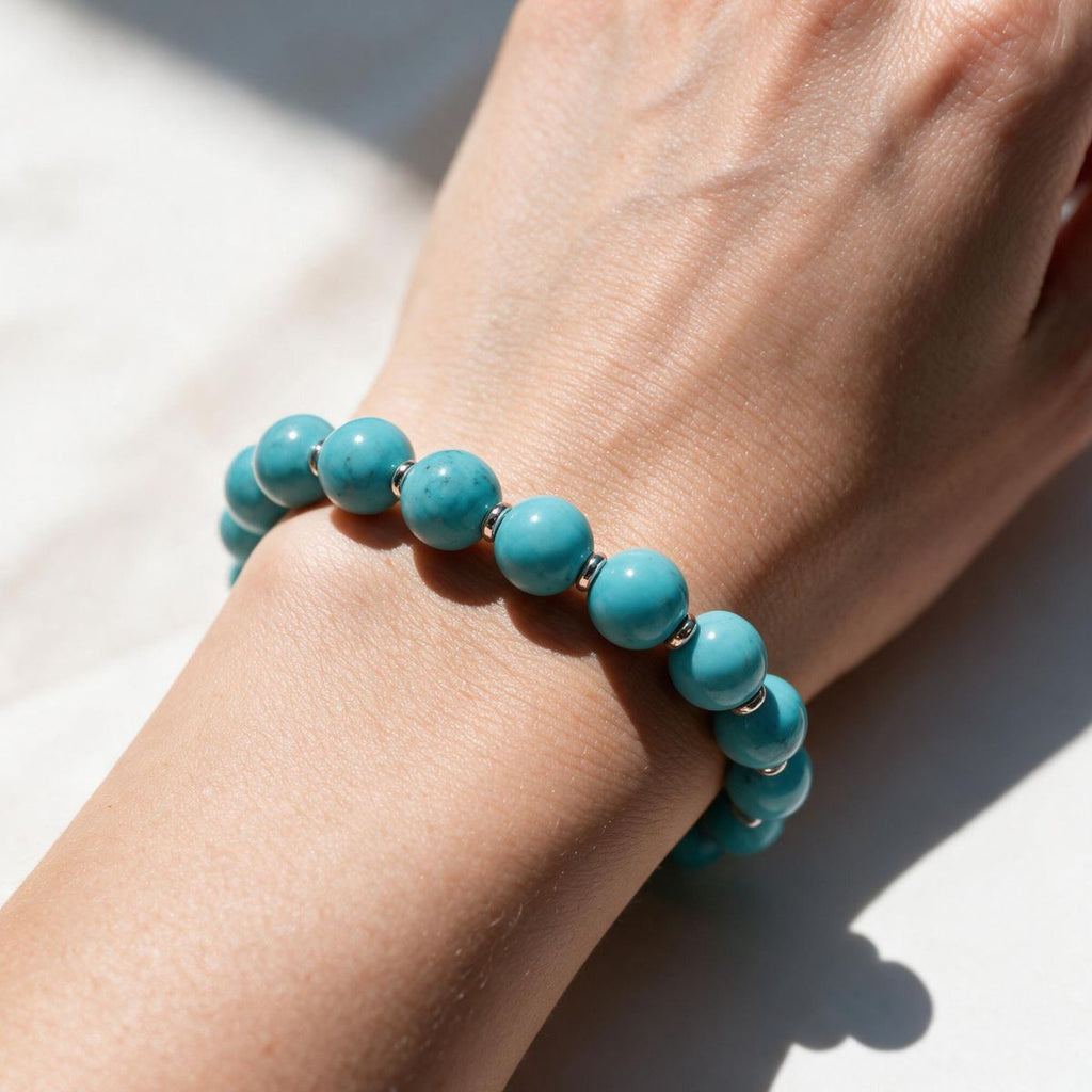 Sky-blue natural turquoise bracelet styled on a woman's wrist in natural light