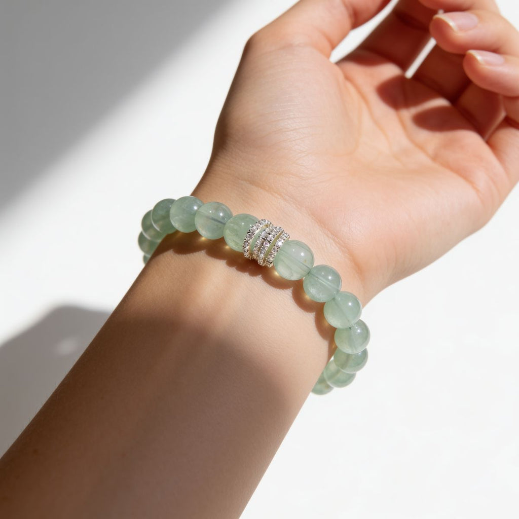 Woman wearing a South African Green Fluorite beaded bracelet with soft mint-green translucent beads