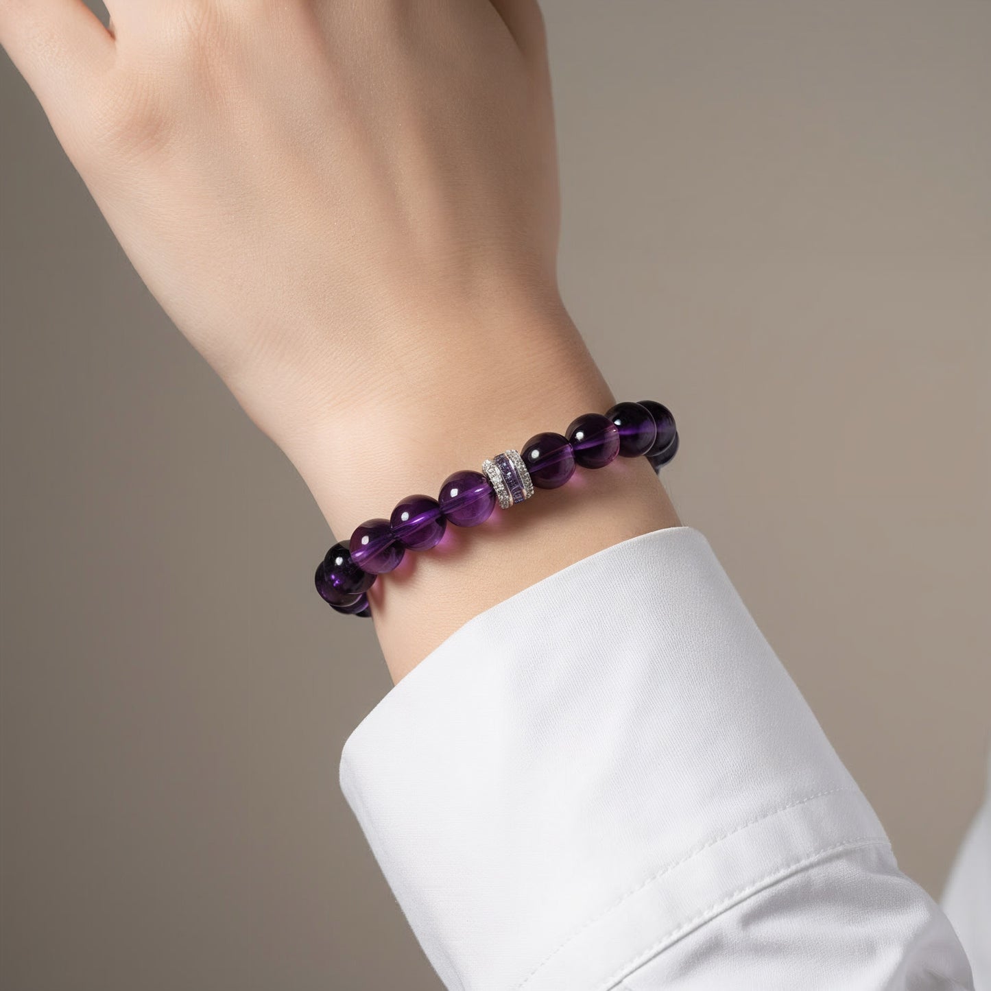 elegant amethyst bracelet worn on wrist, purple crystal healing jewelry for calm and emotional balance