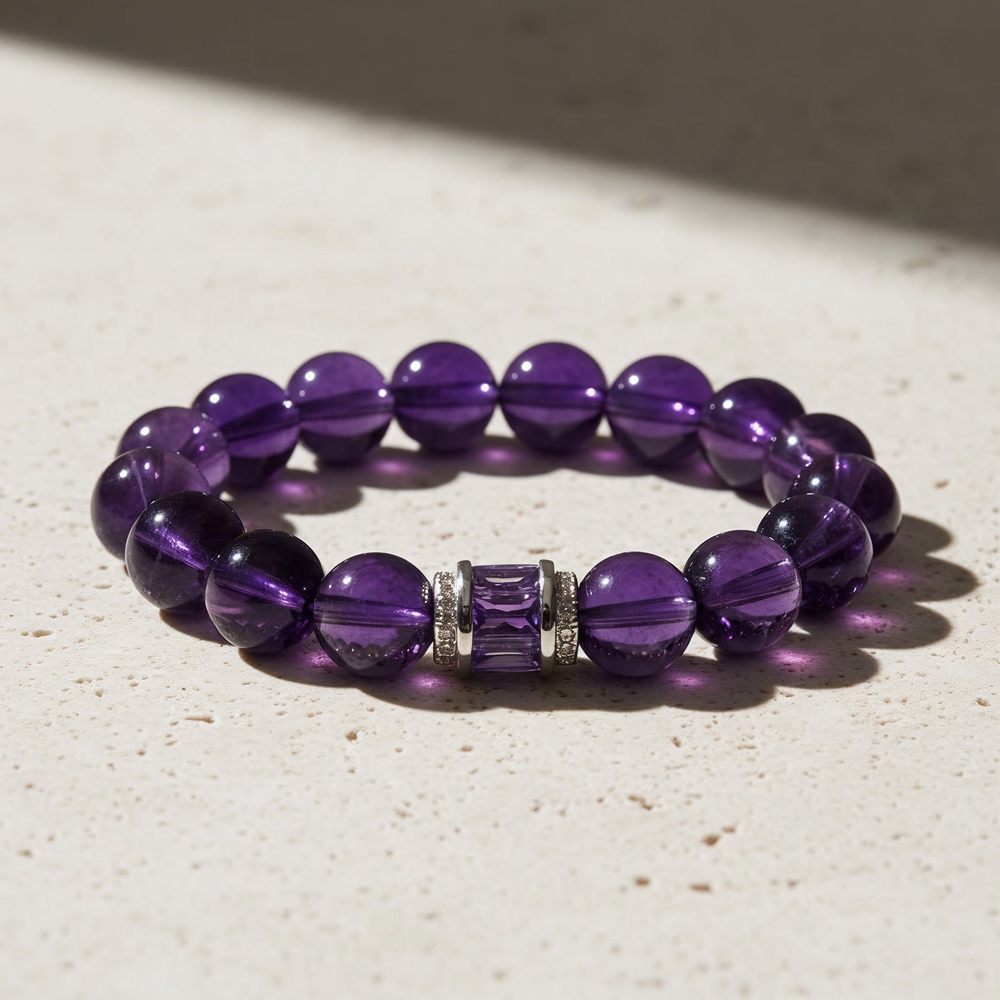 natural amethyst gemstone bracelet displayed on surface, purple birthstone healing jewelry
