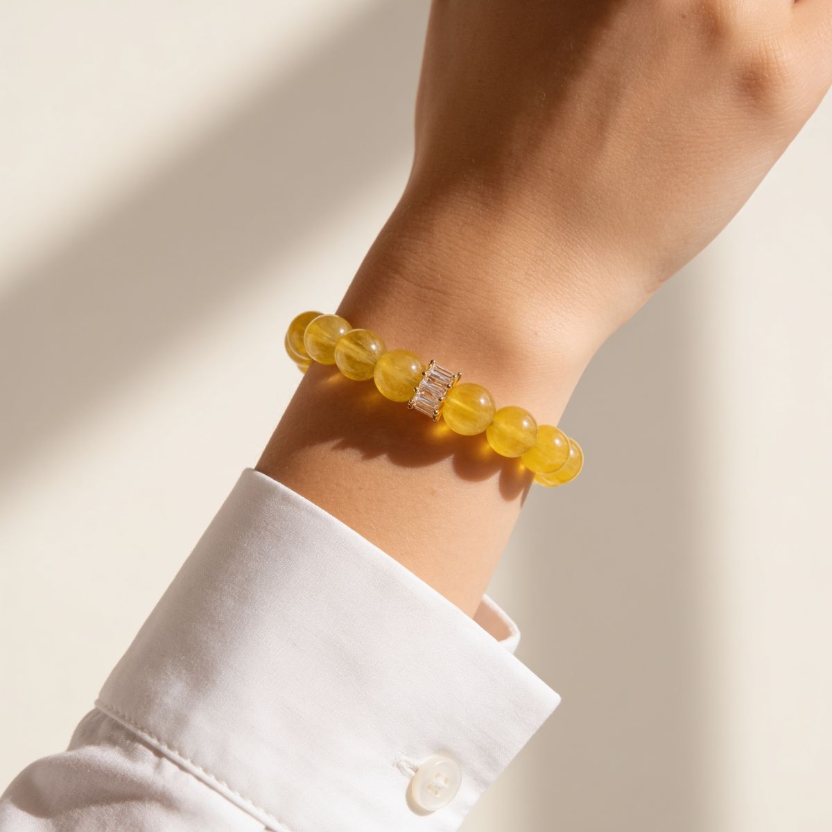 Yellow Fluorite bracelet styled with a white shirt for a warm feminine everyday look